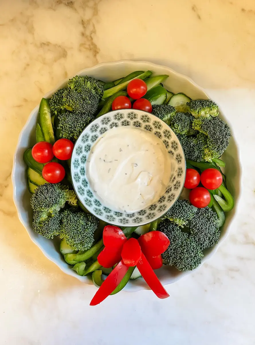 a bowl of vegetables and dip