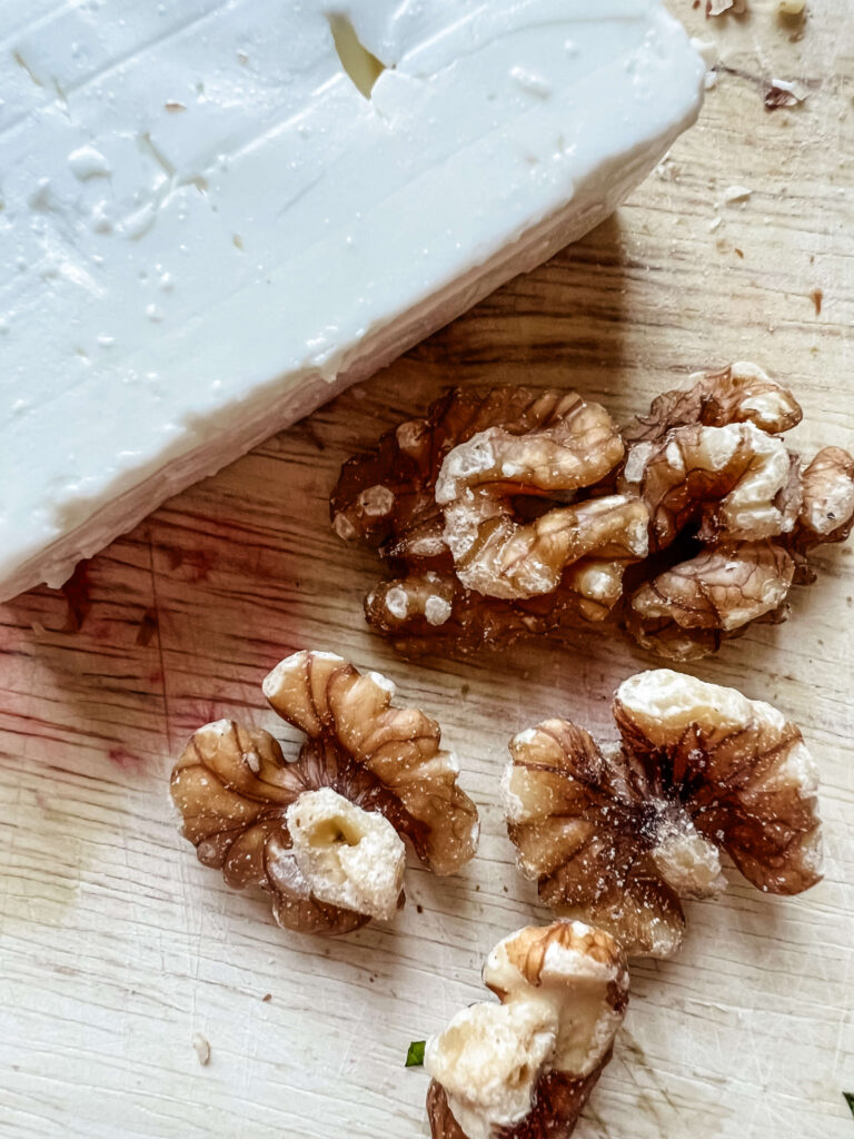 Feta and rhubard on a wooden cutting board