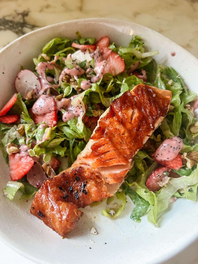 Salad with strawberries, rhubarb, and salmon